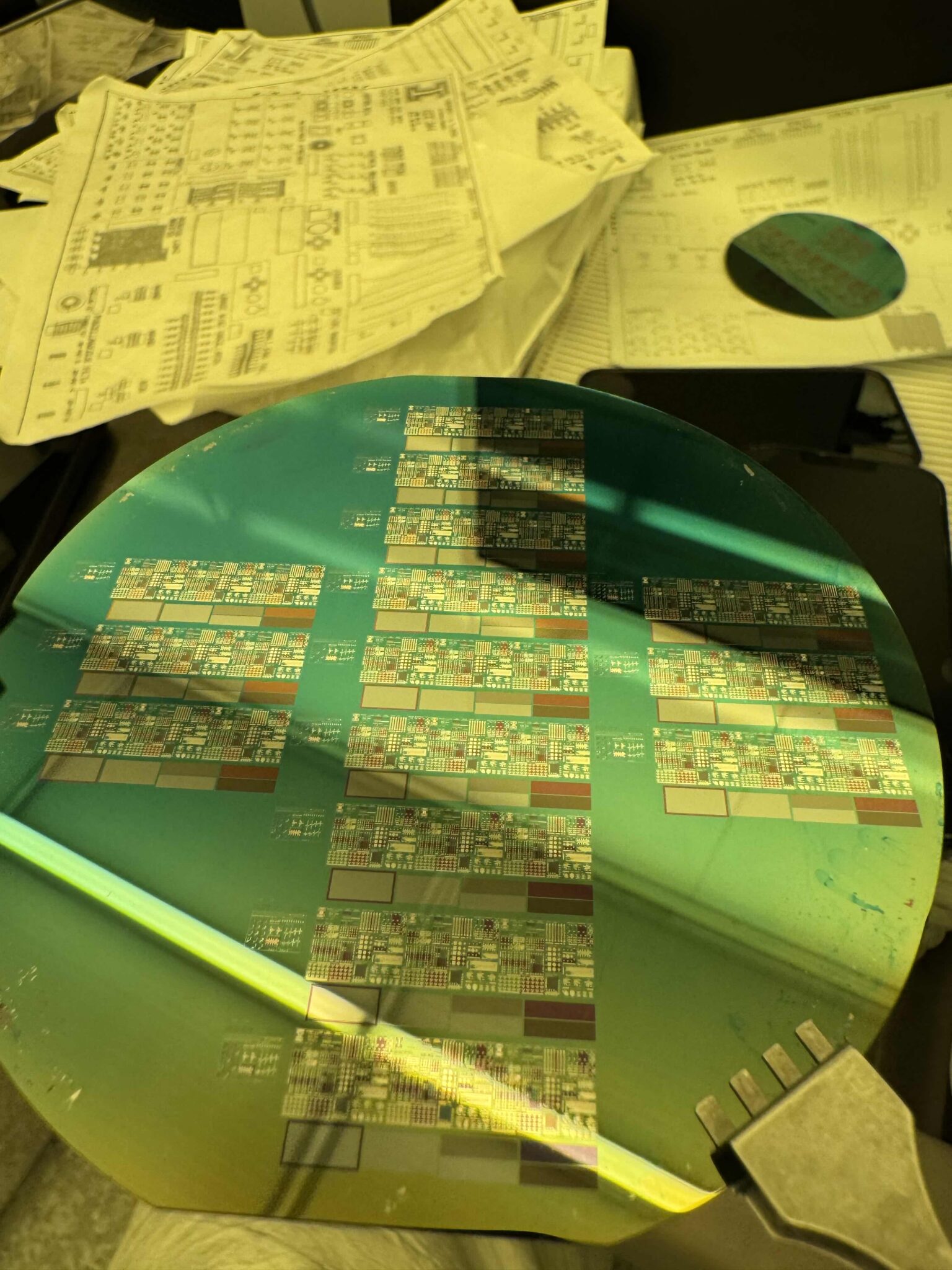 Fabricated silicon wafer from ECE 444 under a probe station